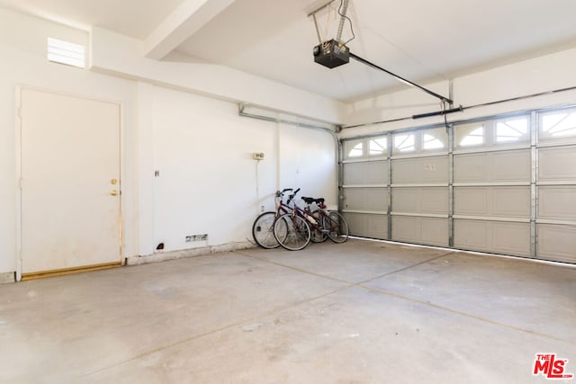 garage featuring a garage door opener