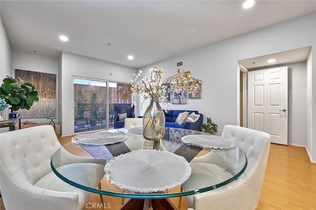 living room with light hardwood / wood-style flooring