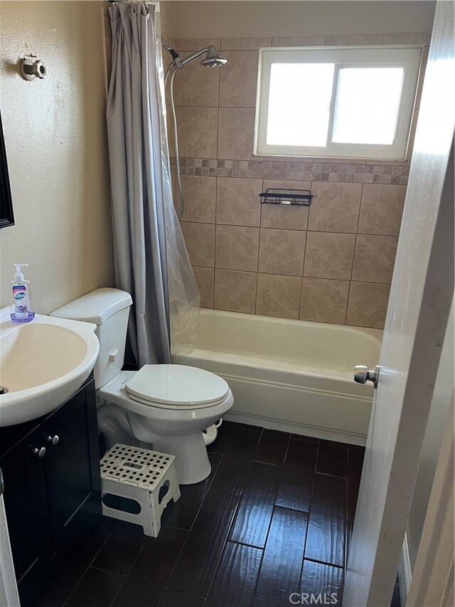 full bathroom featuring vanity, toilet, and shower / bathtub combination with curtain