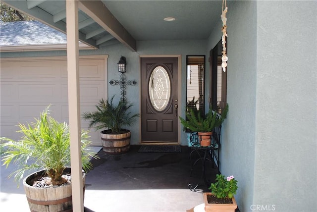 entrance to property featuring a garage