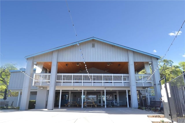 back of house featuring a balcony