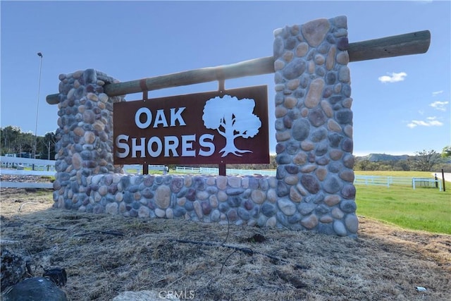 community sign featuring a rural view