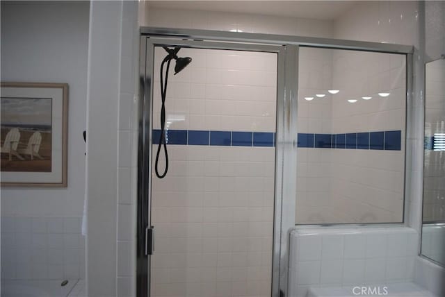 bathroom featuring an enclosed shower