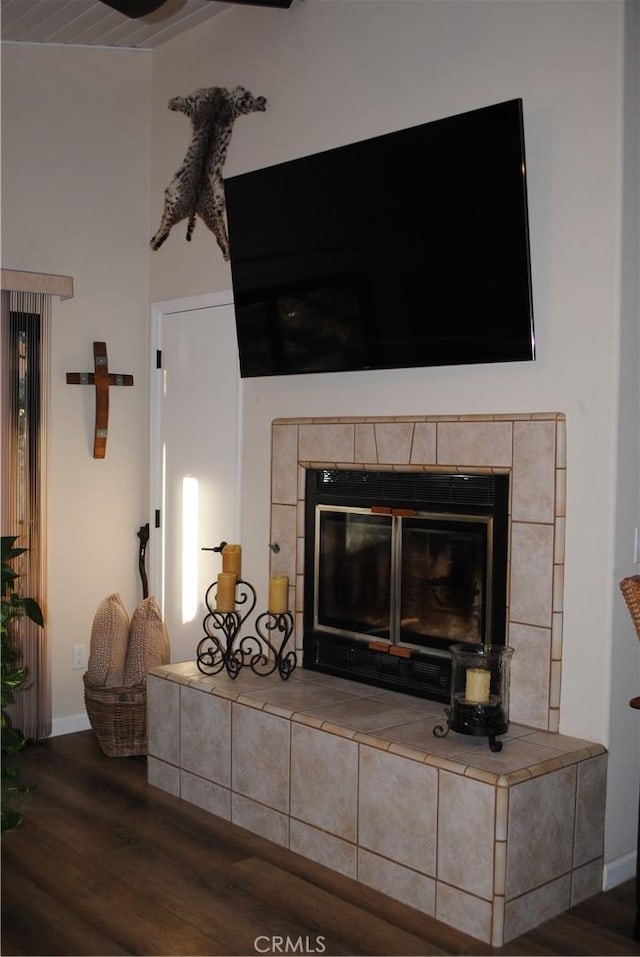 interior details featuring a fireplace and hardwood / wood-style floors