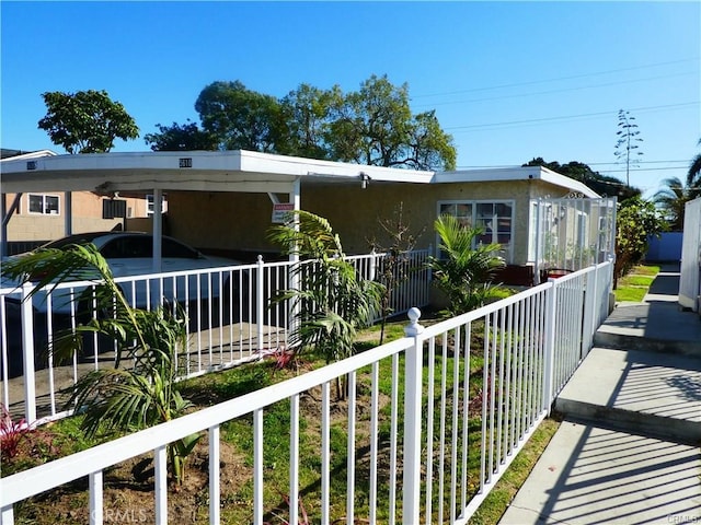 view of front facade featuring a carport