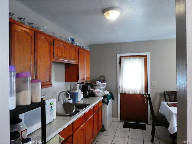 kitchen with sink and light tile patterned floors