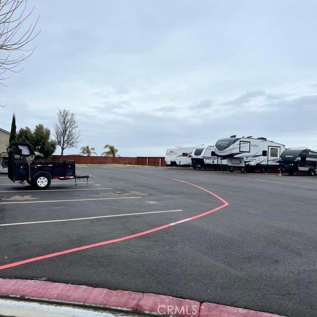 uncovered parking lot with fence