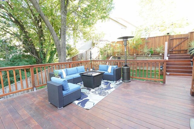 wooden terrace with outdoor lounge area