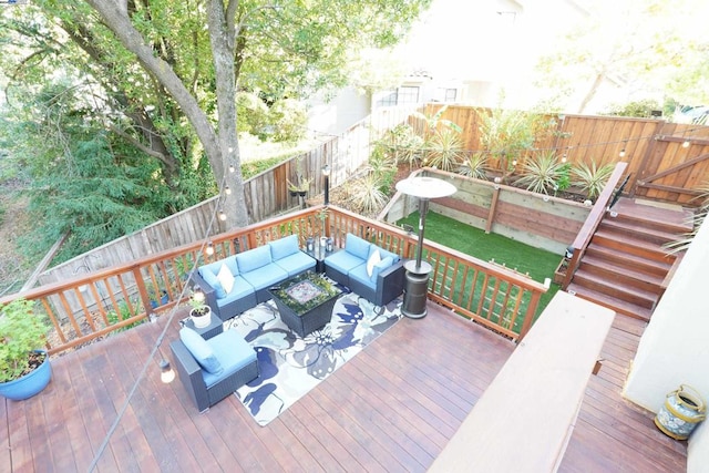 wooden terrace featuring an outdoor living space