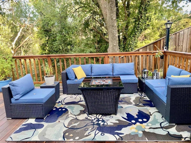 wooden terrace featuring outdoor lounge area