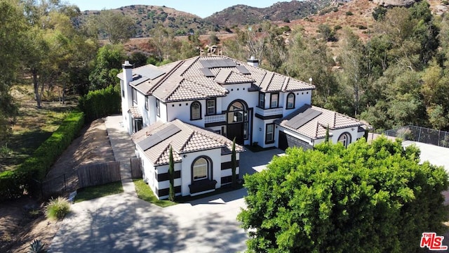 birds eye view of property with a mountain view