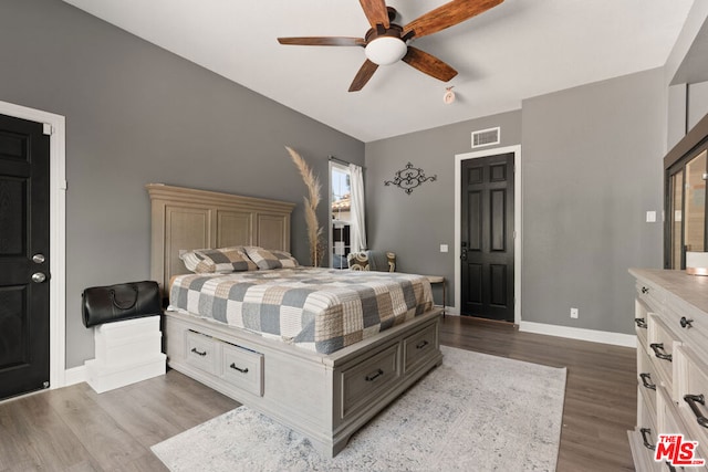 bedroom featuring ceiling fan and light hardwood / wood-style flooring