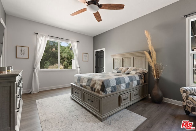 bedroom featuring dark hardwood / wood-style floors and ceiling fan