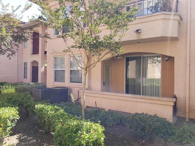 exterior space with central AC and a balcony