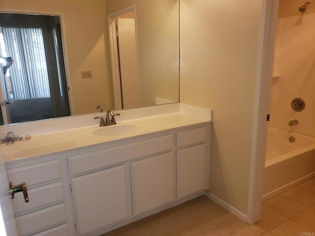 bathroom with vanity, tile patterned flooring, and shower / bath combination