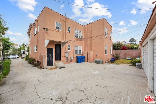 rear view of house with a patio