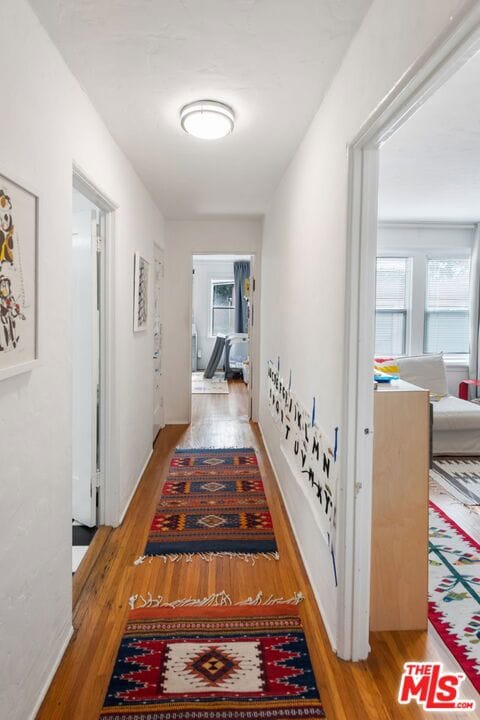 hallway featuring hardwood / wood-style floors