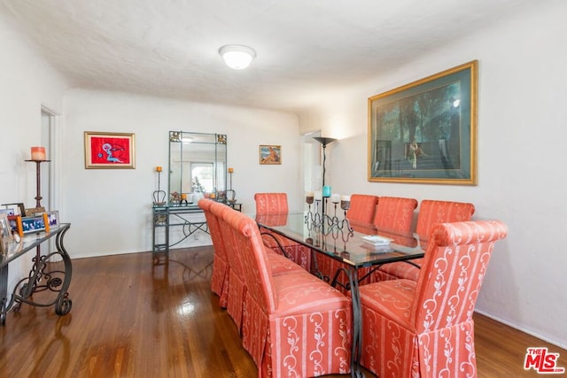 dining area featuring dark hardwood / wood-style floors