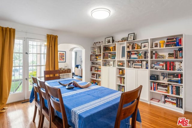 dining space featuring plenty of natural light and light hardwood / wood-style floors