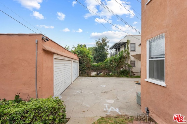 view of patio with a garage