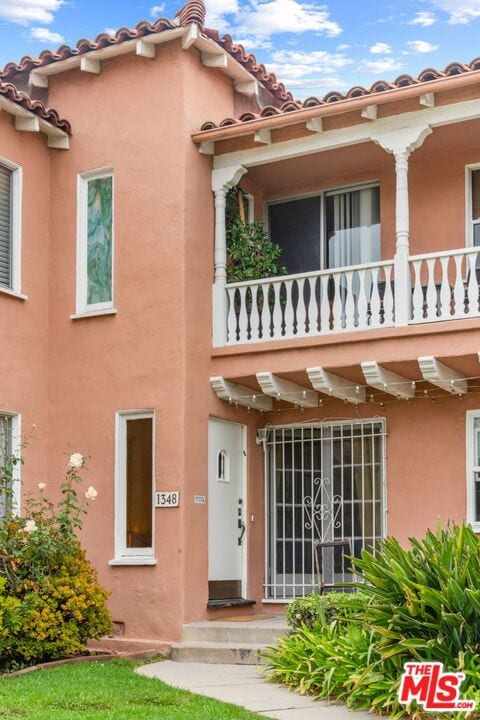 rear view of house featuring a balcony