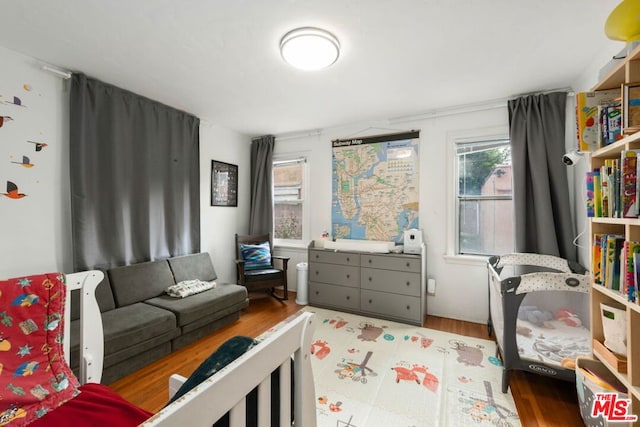 bedroom with light wood-type flooring