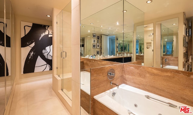 bathroom featuring vanity, shower with separate bathtub, and tile patterned floors