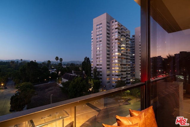 view of balcony at dusk