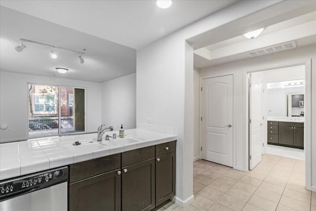 kitchen with dishwasher, tile countertops, sink, dark brown cabinetry, and light tile patterned floors