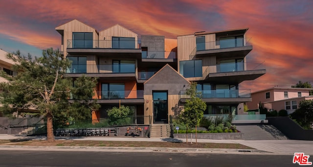 view of outdoor building at dusk