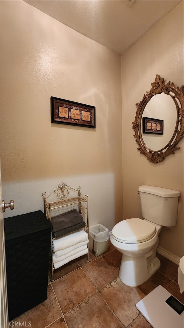 bathroom featuring toilet and tile patterned floors