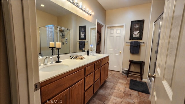 bathroom featuring vanity and a shower with shower door