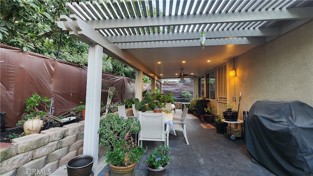 view of patio featuring a pergola, ceiling fan, and a grill