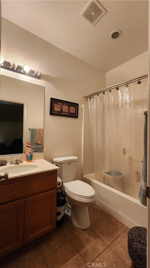 full bathroom featuring vanity, toilet, tile patterned floors, and shower / bathtub combination with curtain