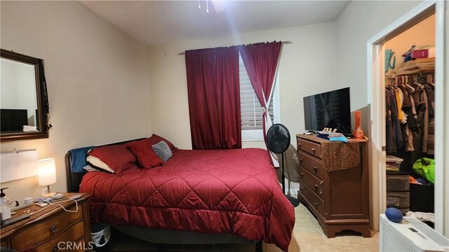 bedroom with light tile patterned floors