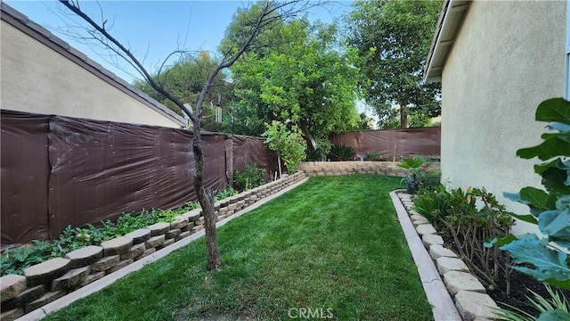 view of yard featuring a fenced backyard