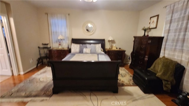 bedroom with wood-type flooring