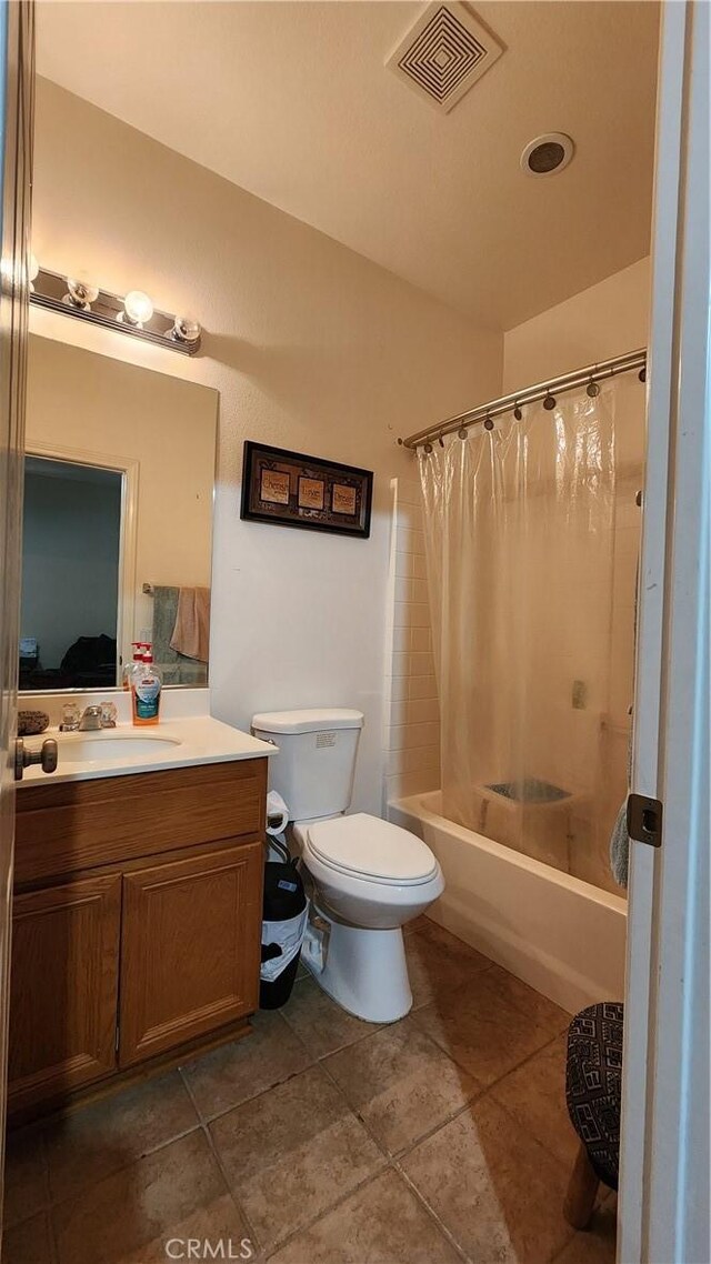 full bathroom featuring vanity, toilet, tile patterned floors, and shower / bathtub combination with curtain