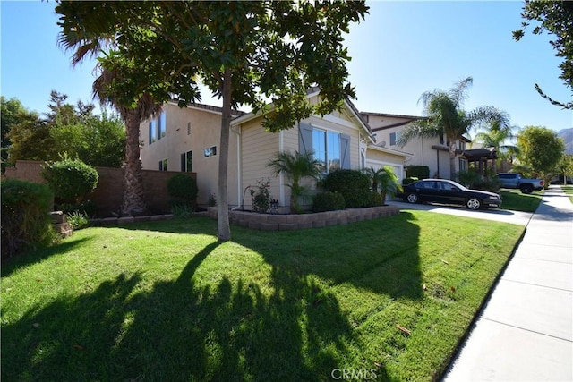 view of side of home with a lawn