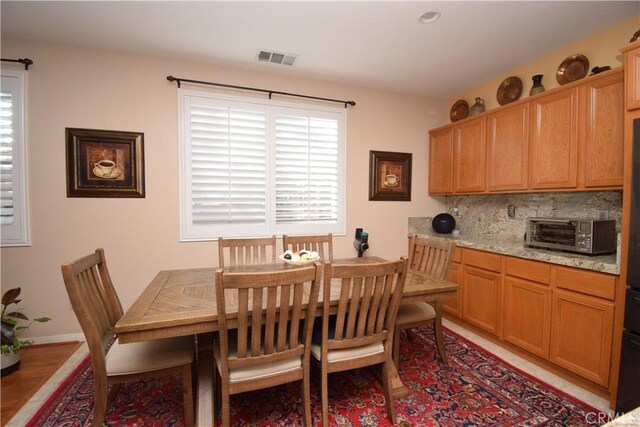 dining room with light hardwood / wood-style floors