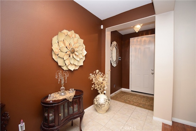 foyer entrance featuring light tile patterned floors