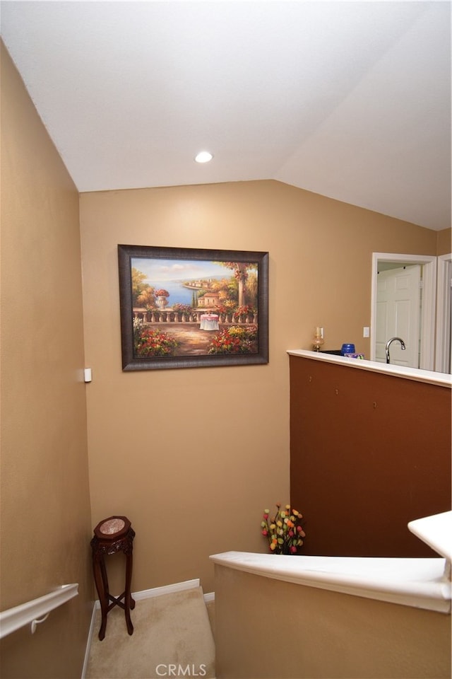 bathroom featuring lofted ceiling