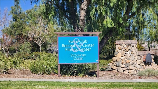 community sign with fence