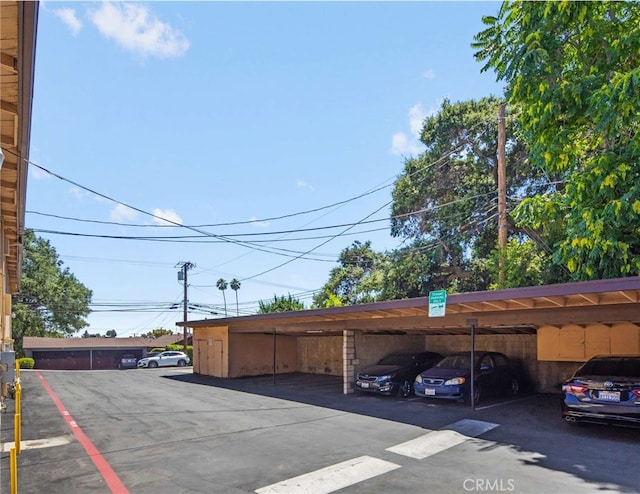 view of parking / parking lot with a carport