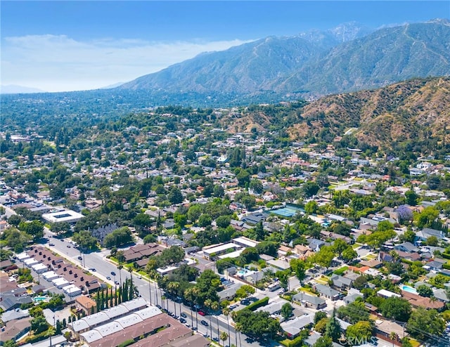 birds eye view of property featuring a mountain view