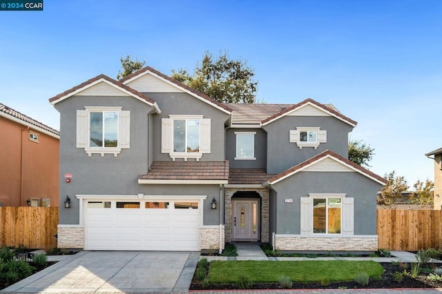 view of front of property featuring a garage and a front yard