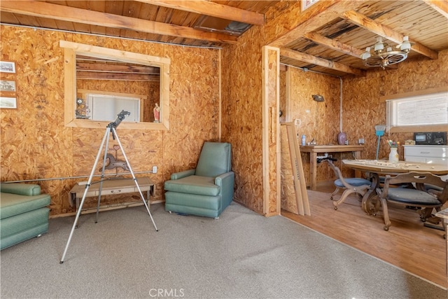 living area featuring wood-type flooring, beamed ceiling, and wood ceiling