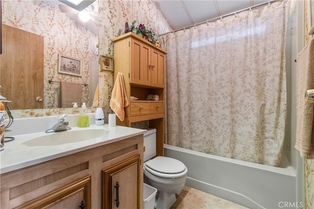 full bathroom featuring shower / bath combo, vanity, and toilet