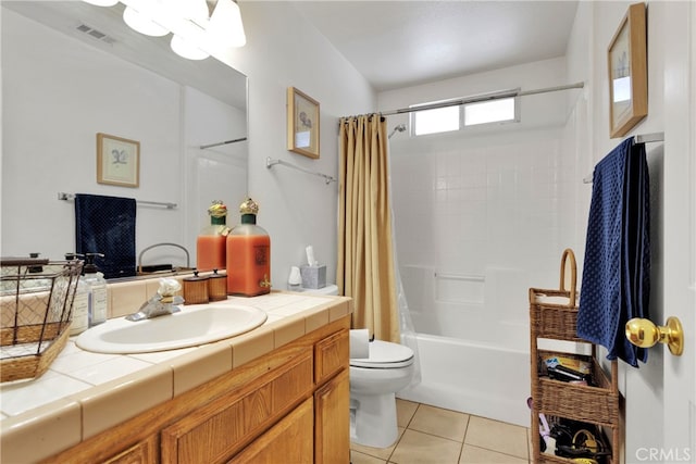 full bathroom featuring tile patterned floors, vanity, shower / bath combo with shower curtain, and toilet