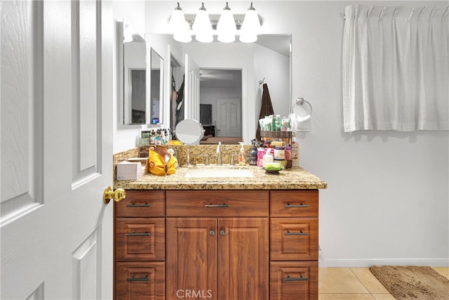 bathroom with tile patterned floors and vanity